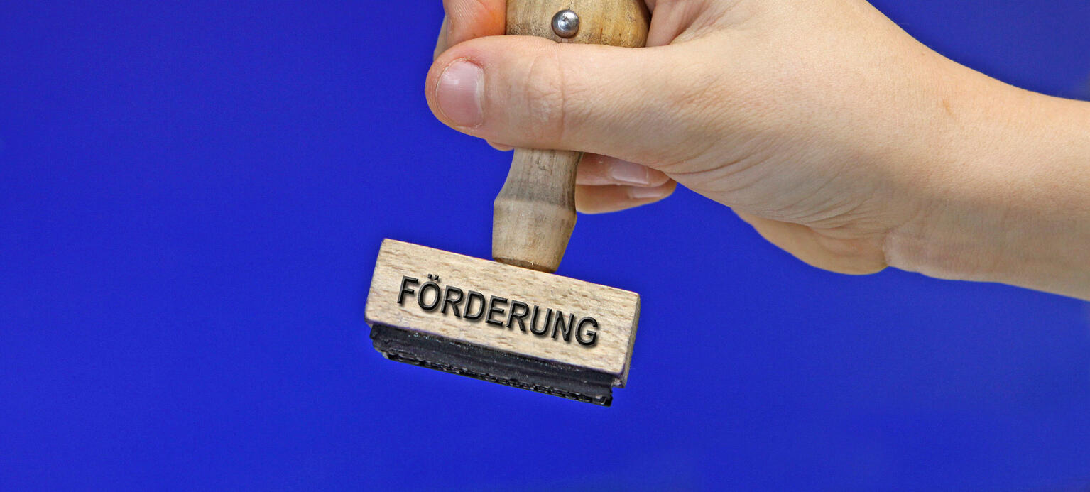 Symbolbild: Stempel mit der Aufschrift 'Förderung'